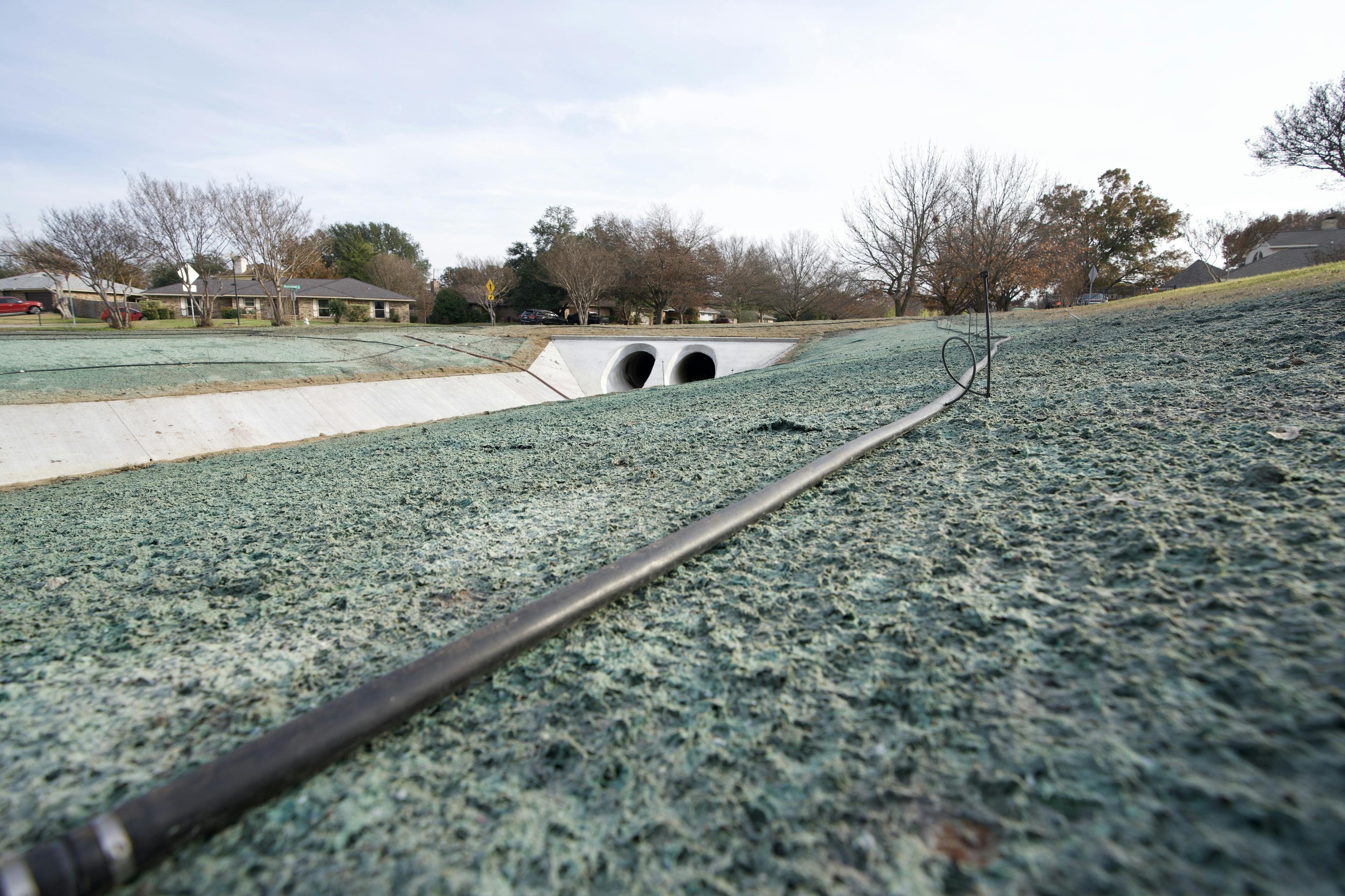 To mitigate the risk, a channel outlet was constructed to divert water away from the endangered houses