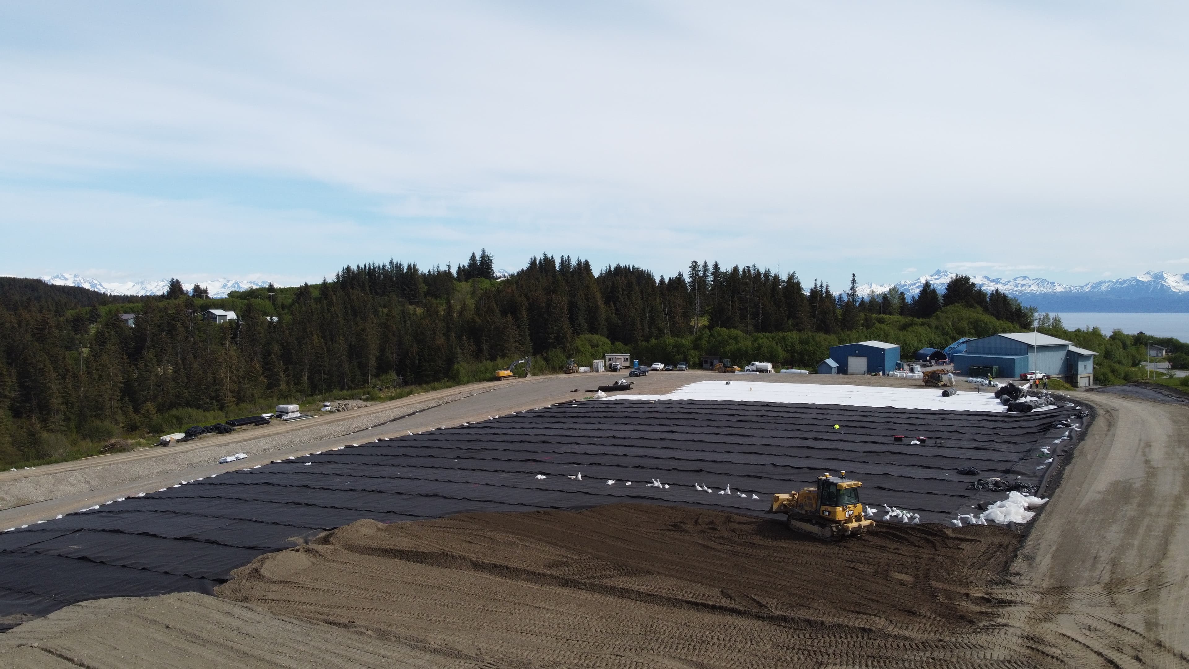 Solmax geosynthetics, including BENTOLINER, FABRINET geocomposite, and GSE LL geomembrane, were utilized to manage the steep gradients and poor sub-surface conditions of the site 