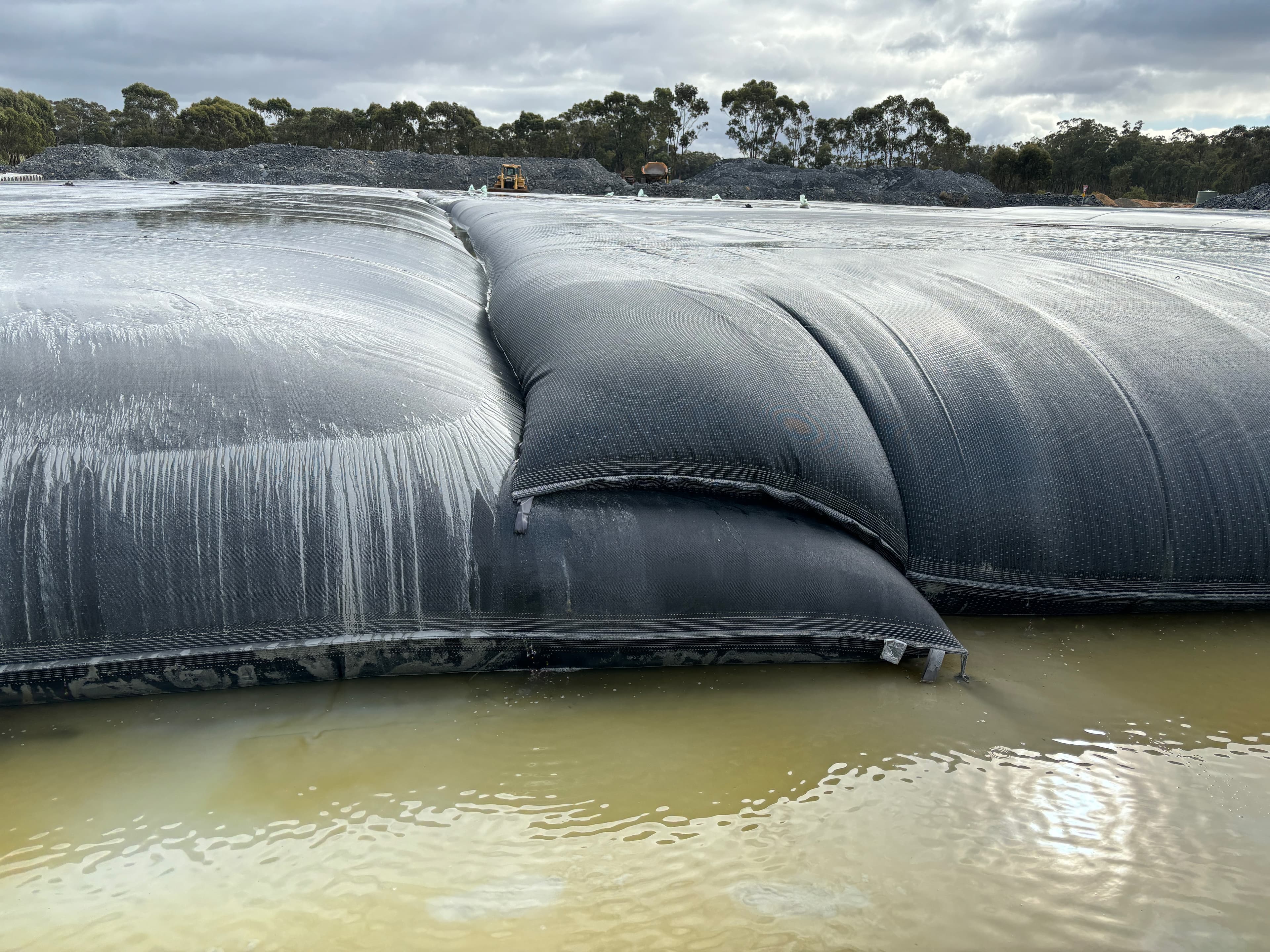 Effluent water being collected in sumps for reuse, demonstrating the sustainable water management approach of the GEOTUBE® system