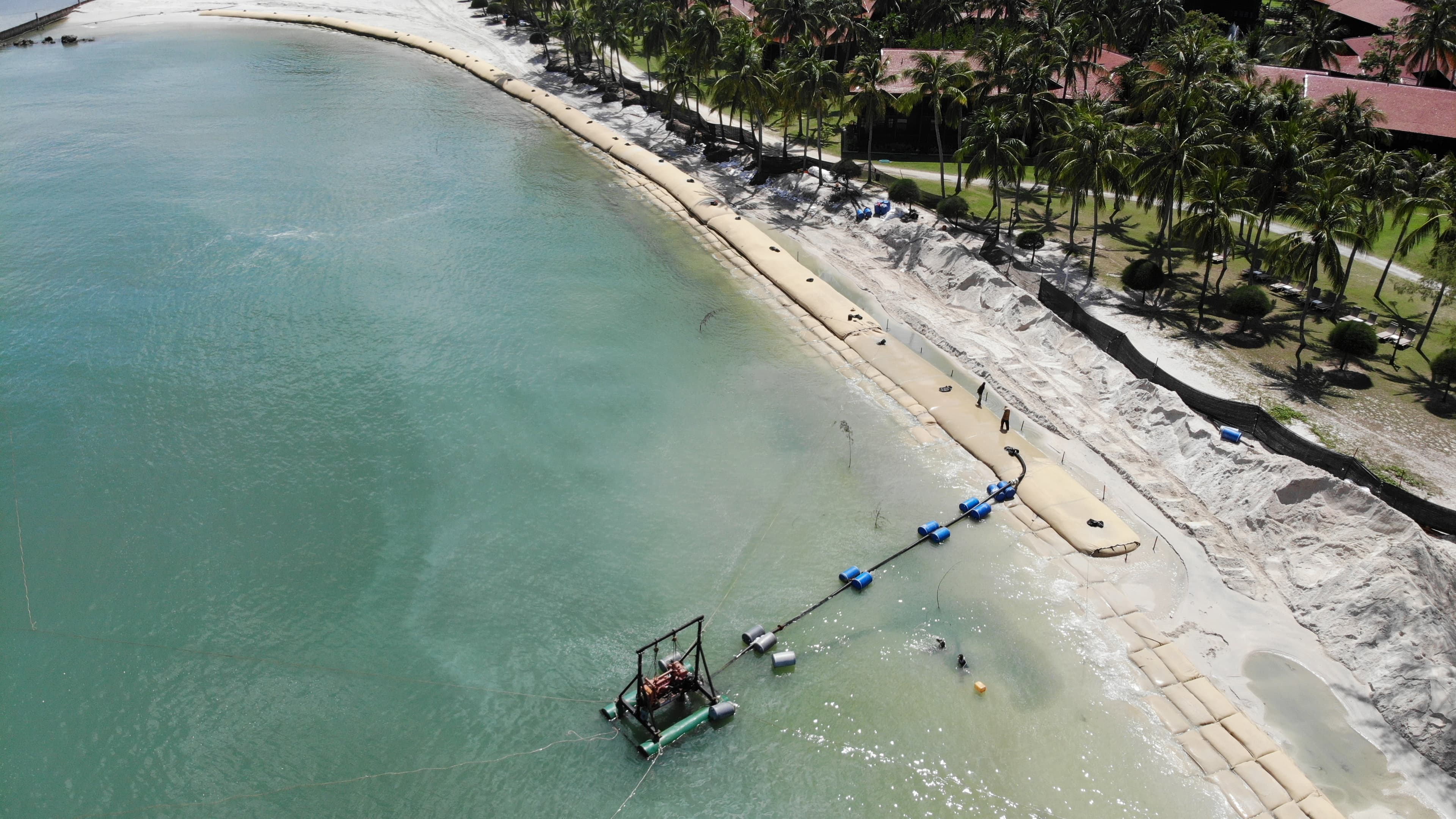 The installation process involved deploying scour aprons and filling anchor tubes prior to placing the GEOTUBE unit. The targeted shoreline area was trimmed back before laying the filled Geobags in an overlapping shingle style from the embankment's base.